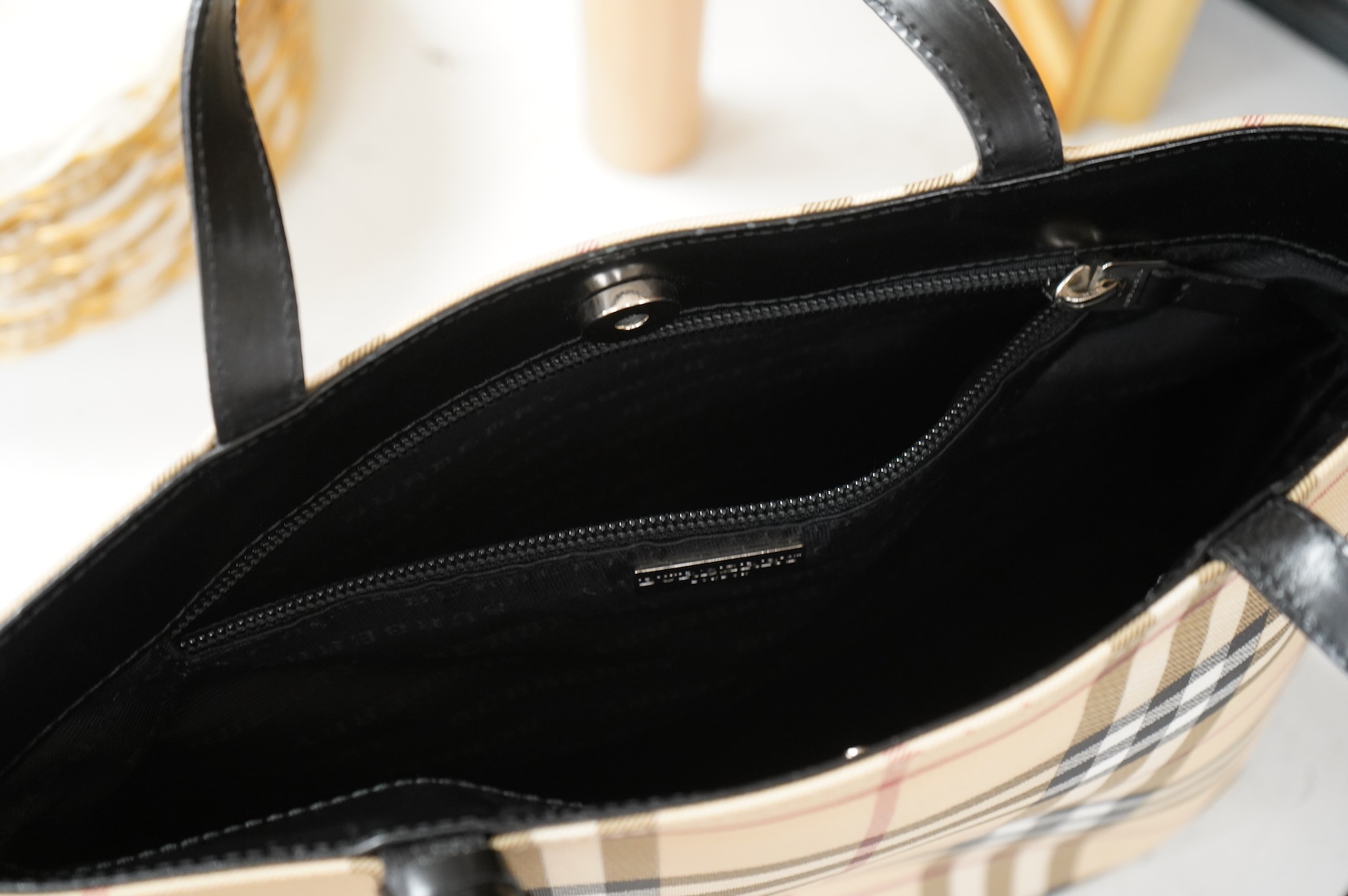 A Burberry handbag with PCV check exterior, 28cm wide